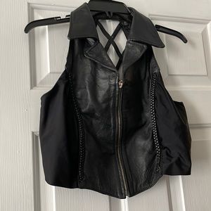 Leather vest. 100% leather  says Xl but not, more a slim large